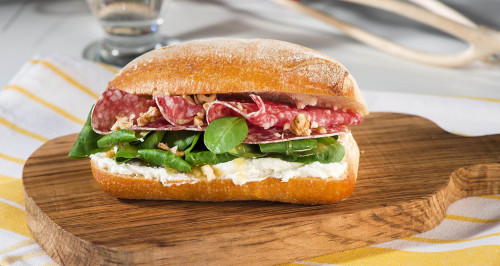 Sandwich with salami, robiola cheese, honey, soncino salad and nuts